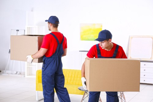 Professional packing team preparing office items