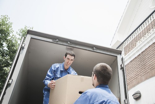 Office furniture being loaded into a removals van