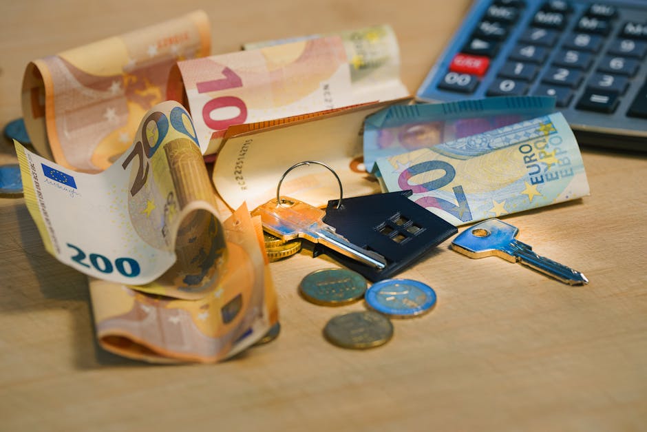 Close-up of a person's hands holding a stack of five and ten euro banknotes, with the left hand gripping the top of the banknotes and the right hand supporting the lower part. The person is wearing a